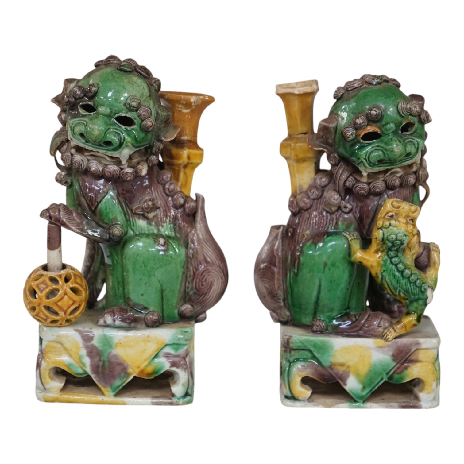 A pair of Chinese Sancai glazed lion joss stick holders, 18th century, 17cm high. Condition - some restoration